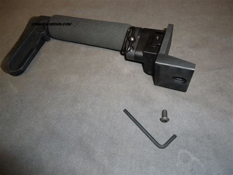 Semi auto 9MM Pistol with fake suppressor. . Masterpiece arms folding stock adapter